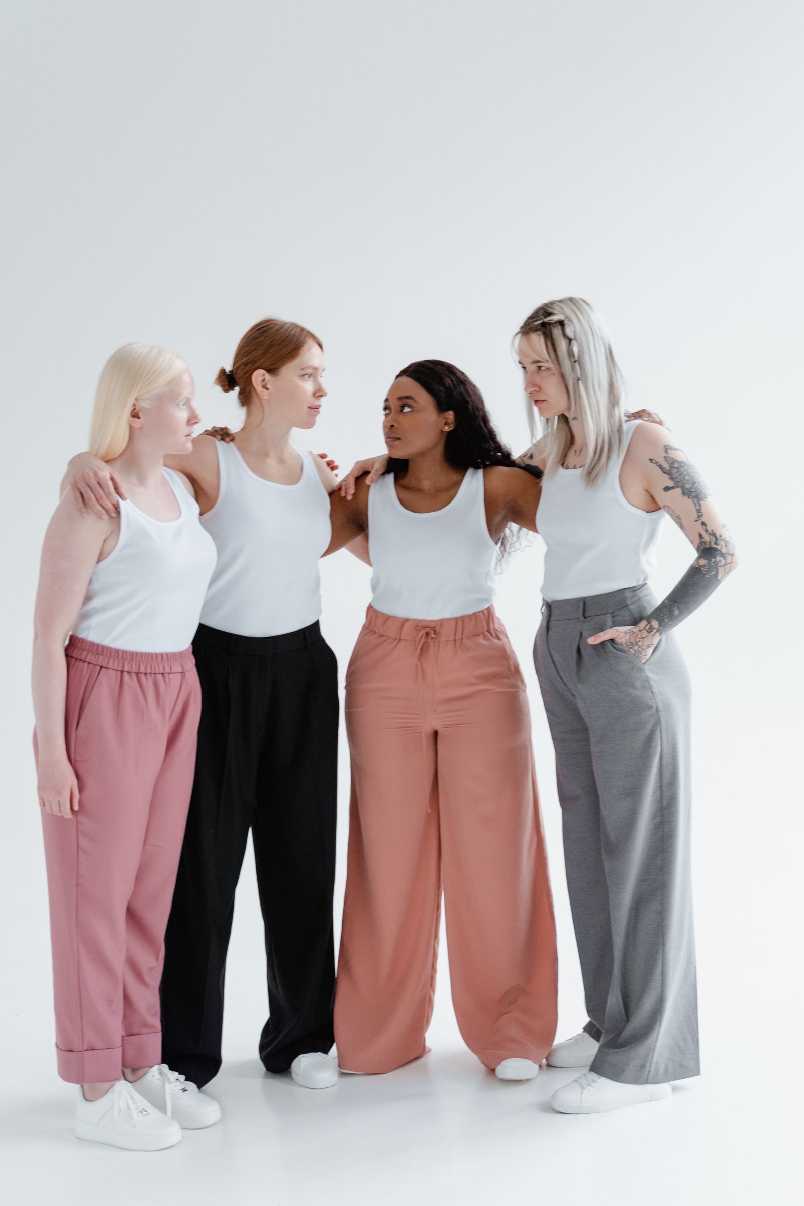 Four women sharing a warm conversation in a home gathering space